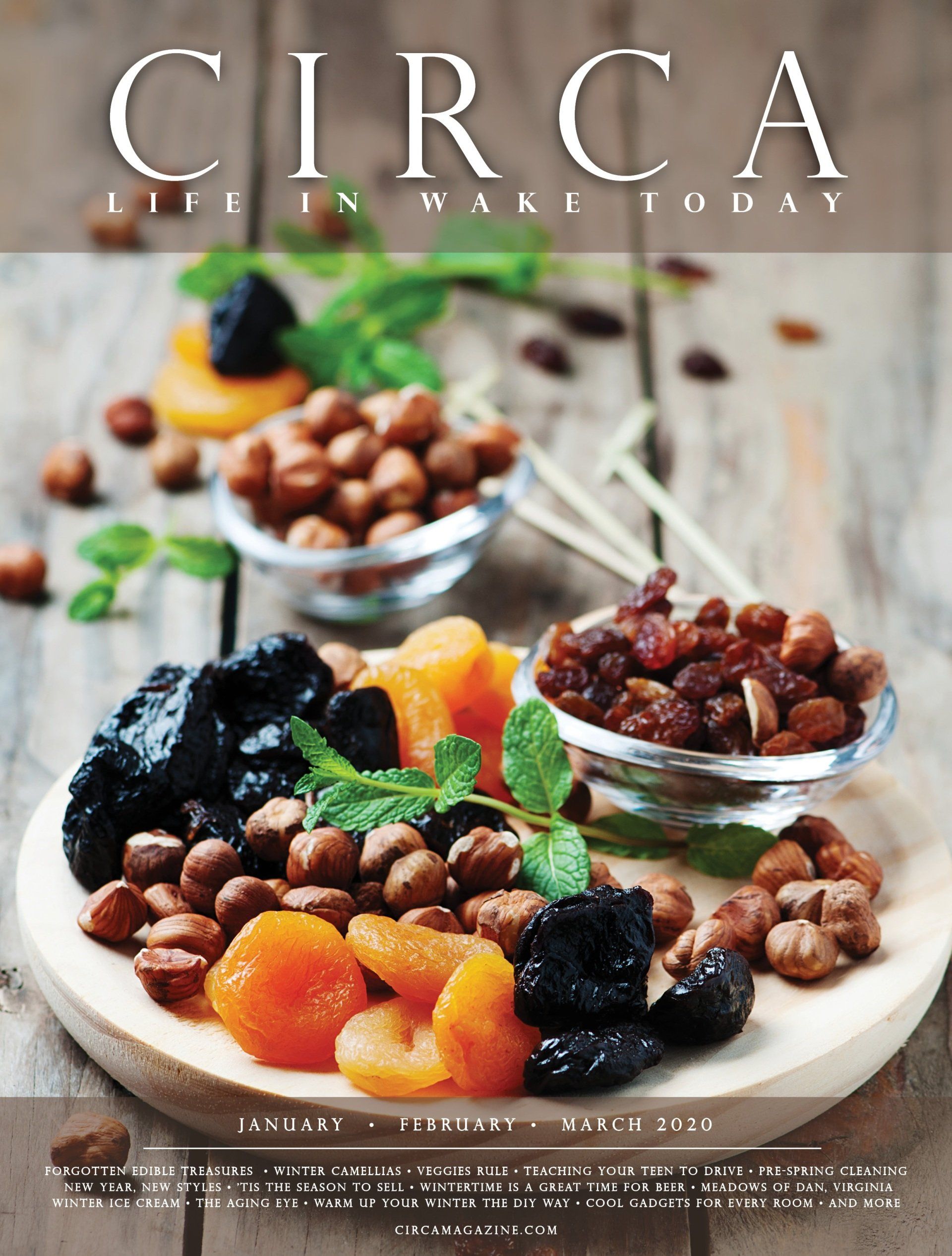 Dried fruits and nuts on a wooden board, with the magazine title 