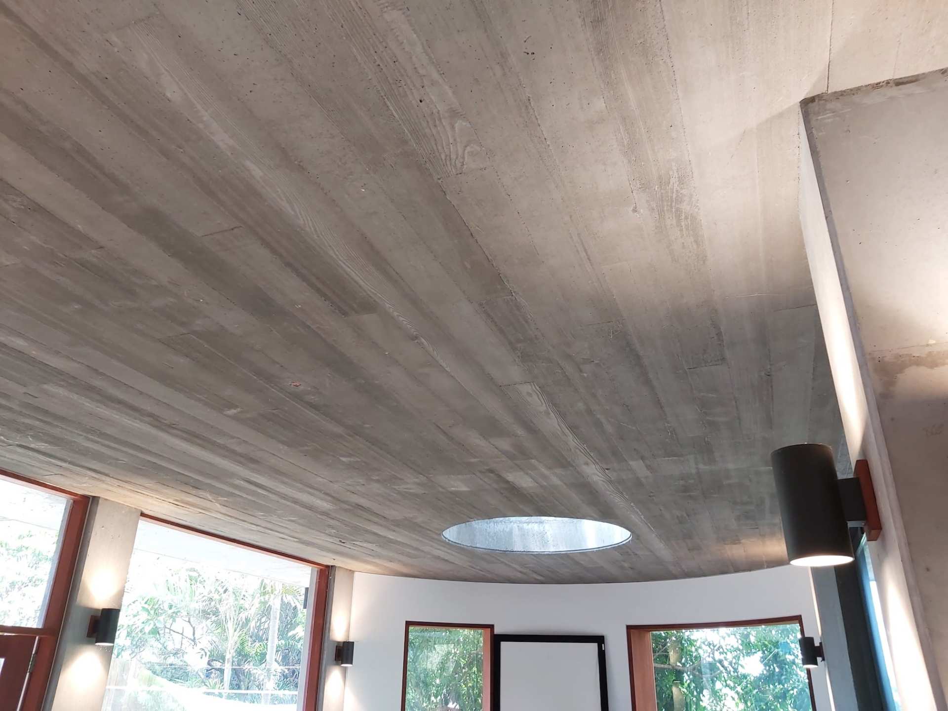 A room with a ceiling that has a hole in it