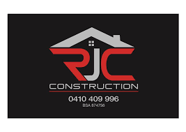 A logo for rjc construction with a house on it