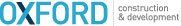 A blue and white logo for oxford construction and development