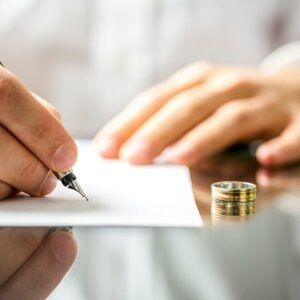 Man signing his divorce papers — Law Office of Stephen T. Fanning in Providence, RI