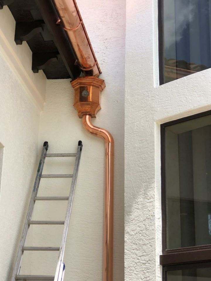 Residential Round Downspouts — Beach, FL — Enterprise Seamless Gutters