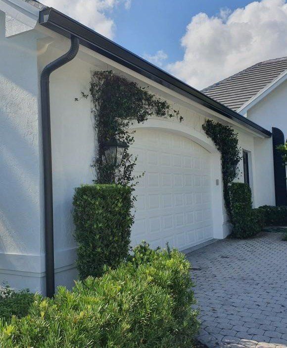White Garage — Beach, FL — Enterprise Seamless Gutters
