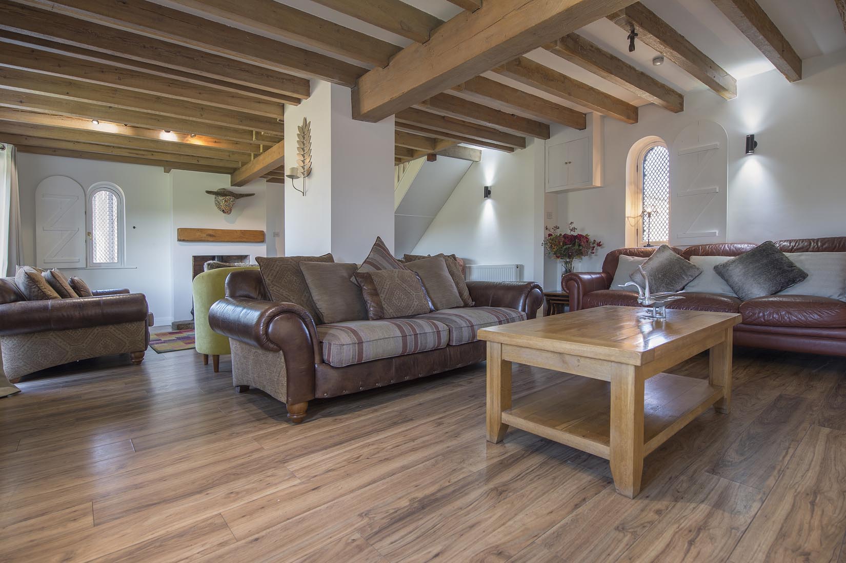 A living room filled with furniture and a coffee table.
