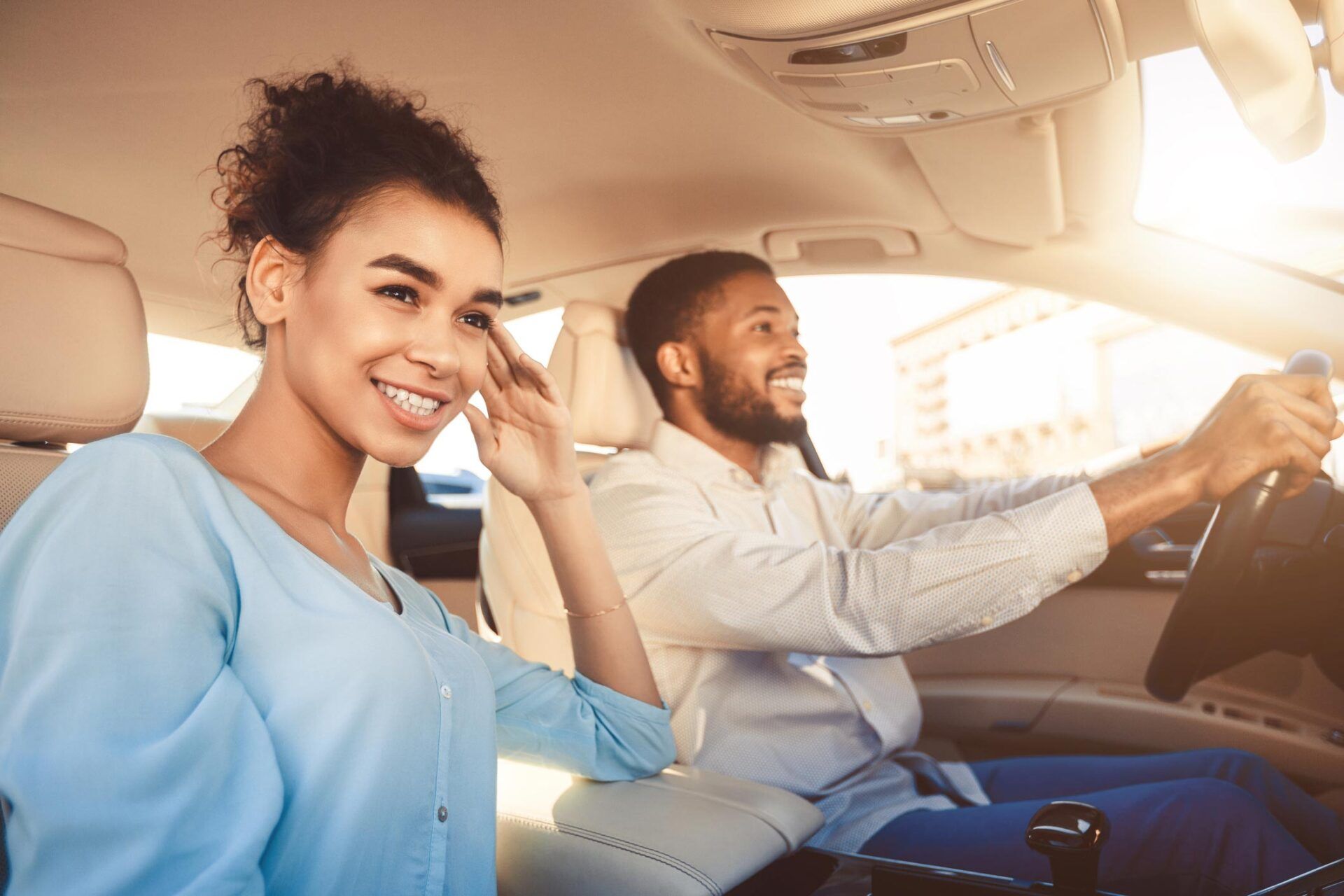 Couple Happily Driving Car — Homestead, FL — South Dade Auto Tag Agency