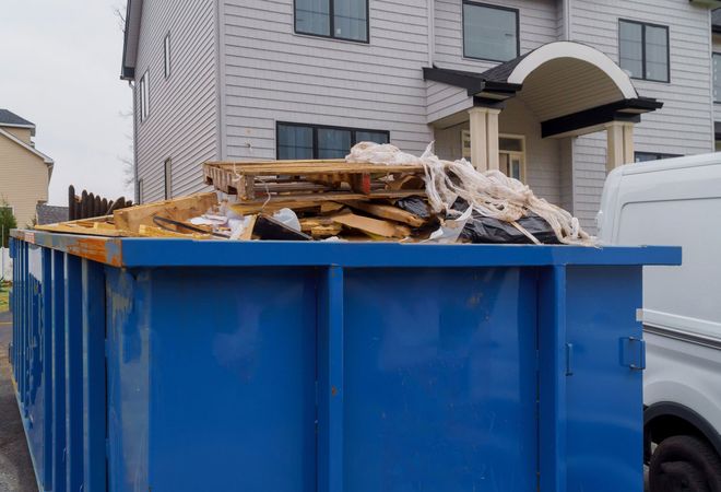 Blue Garbage Dumpster Full of Waste — Station, VA — C & S Disposal Blue Garbage Dumpster Full of Waste — Station, VA — C & S Disposal