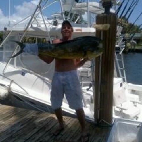 Man  Holding a Big Fish — Dania FL — Ironclad Welding