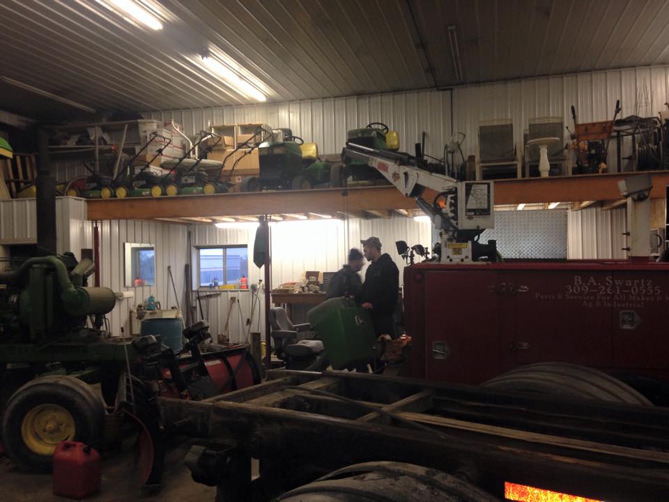Two Men on Dumpsters Truck Warehouse — Roanoke, IL — Kev's Kans, Inc.