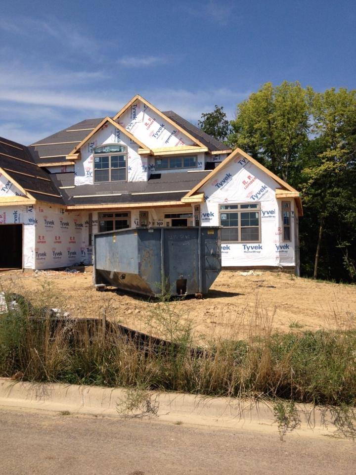 Dumpsters Front of House Construction — Roanoke, IL — Kev's Kans, Inc.