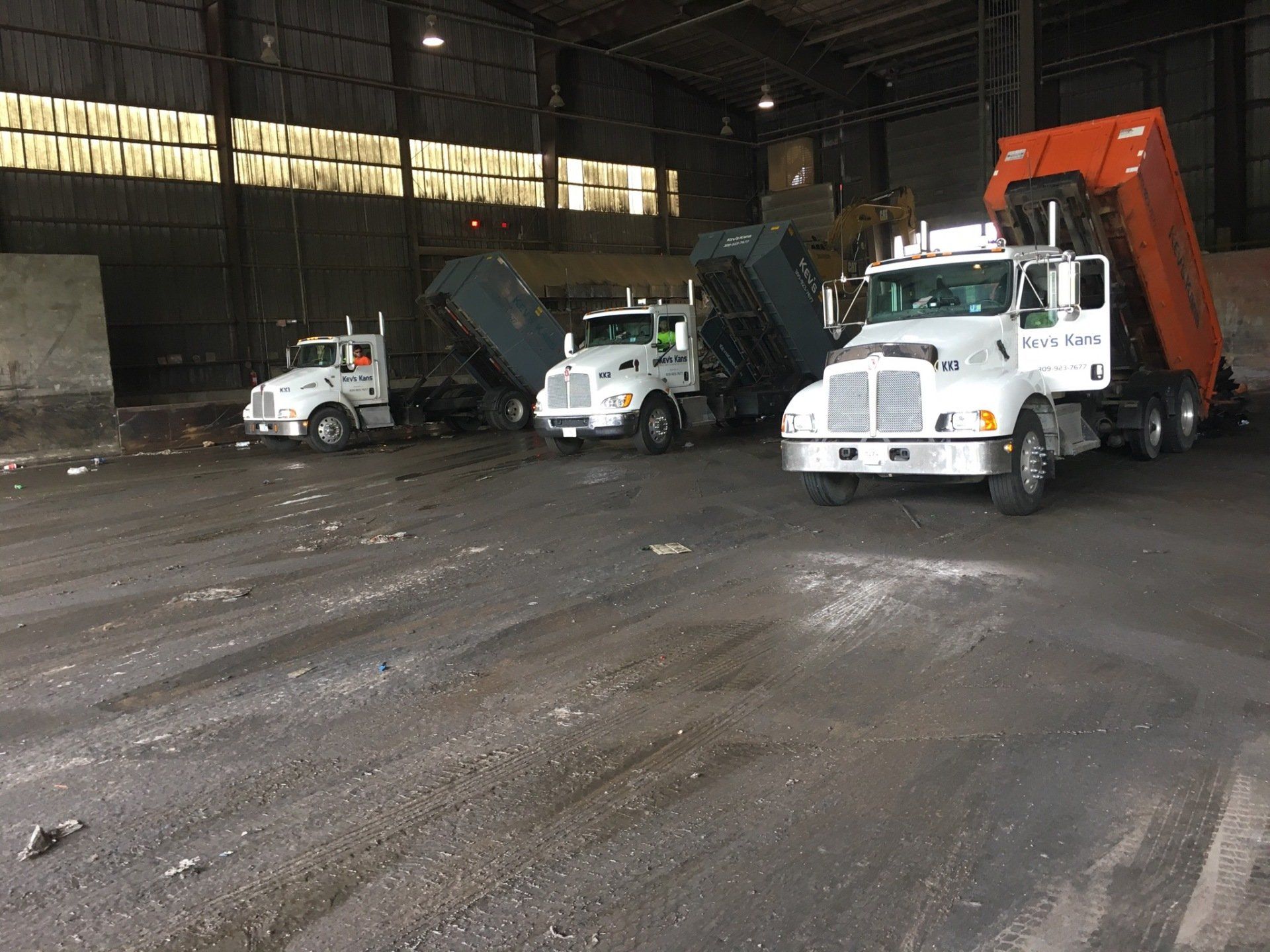 Three Truck Inside Warehouse — Roanoke, IL — Kev's Kans, Inc.