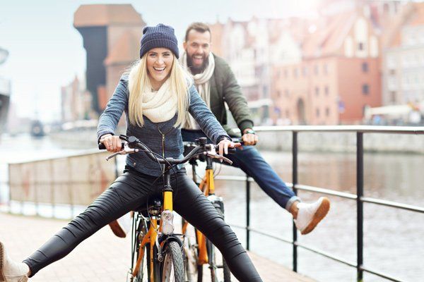 couple riding bikes in the city