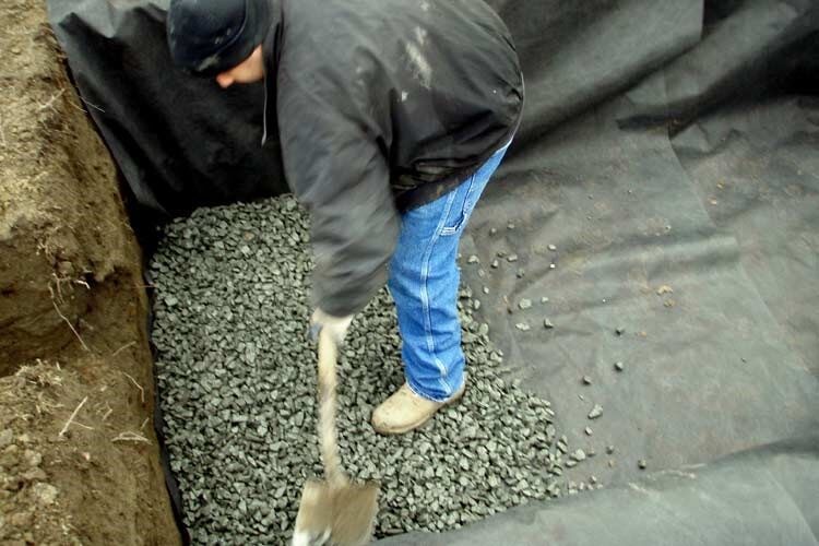 Man Using Shovel — Thornwood, NY — Harry Hudd Architectural Landscapes