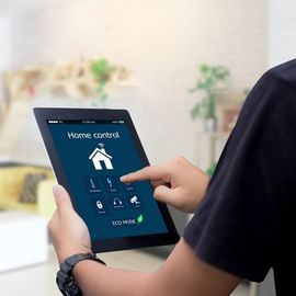 Merrillville — A Man Using A Smart Security Tablet In Merrillville, IN