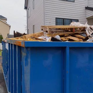 Container with Construction Debris — Pueblo, CO — Dionisio Roll-Off Service Container with Construction Debris — Pueblo, CO — Dionisio Roll-Off Service