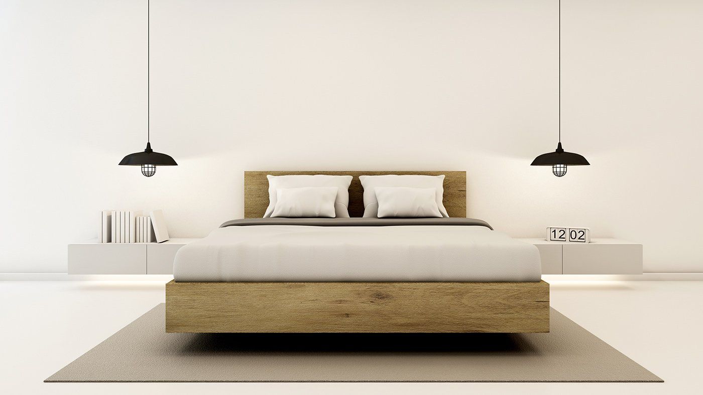 Ein Schlafzimmer mit einem Bett, Nachttischen, Lampen und einem Teppich.