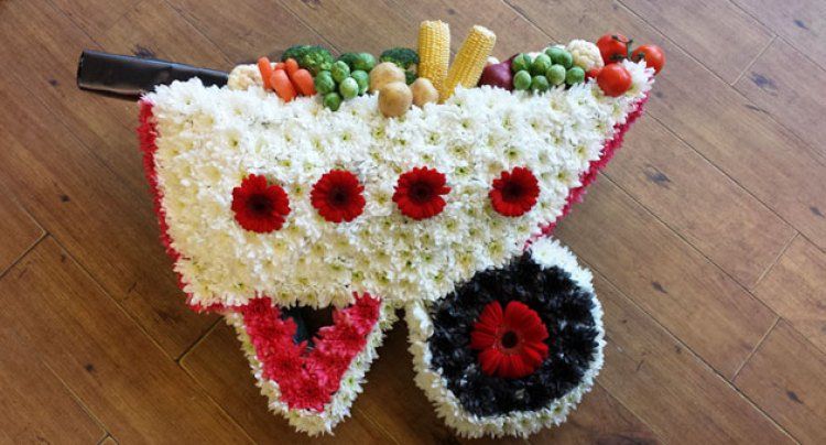 Funeral  flowers arrangement  - wheel barrow