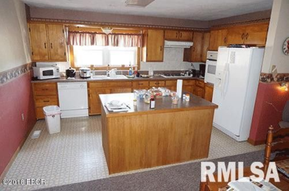 A kitchen with the word rmlsa on the bottom
