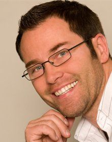 man smiling wearing glasses man smiling wearing glasses
