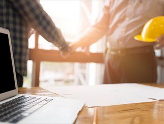 Surety Bond — Architect Engineer Shaking Hands in Cleveland, OH Surety Bond — Architect Engineer Shaking Hands in Cleveland, OH
