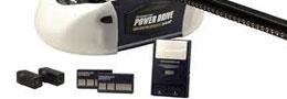 A picture of a garage door opener with a remote control.
