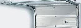 A close up of a garage door with the door open.