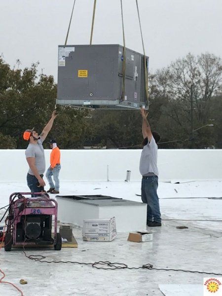 installing HVAC on the roof 2
