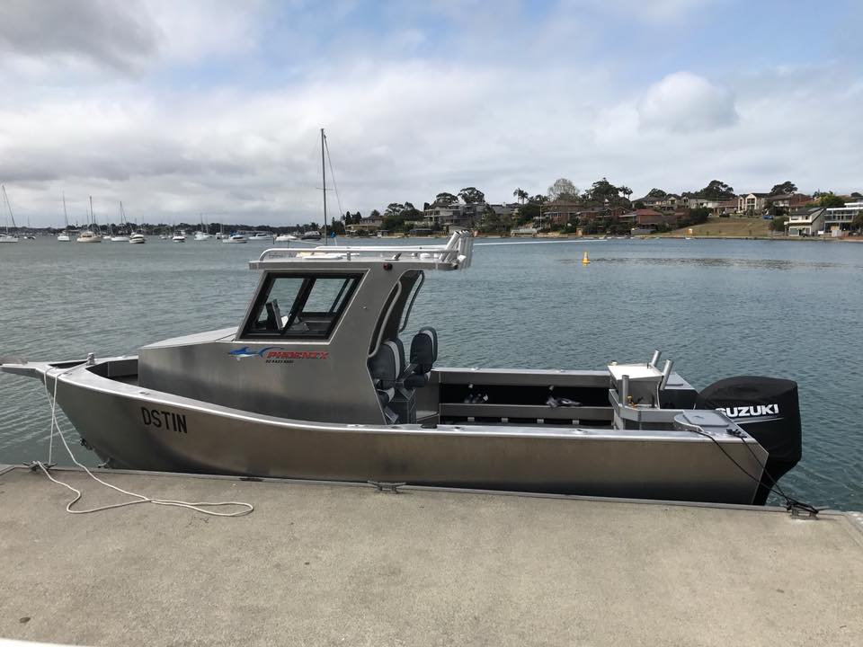 port shot of a docked aluminium boat