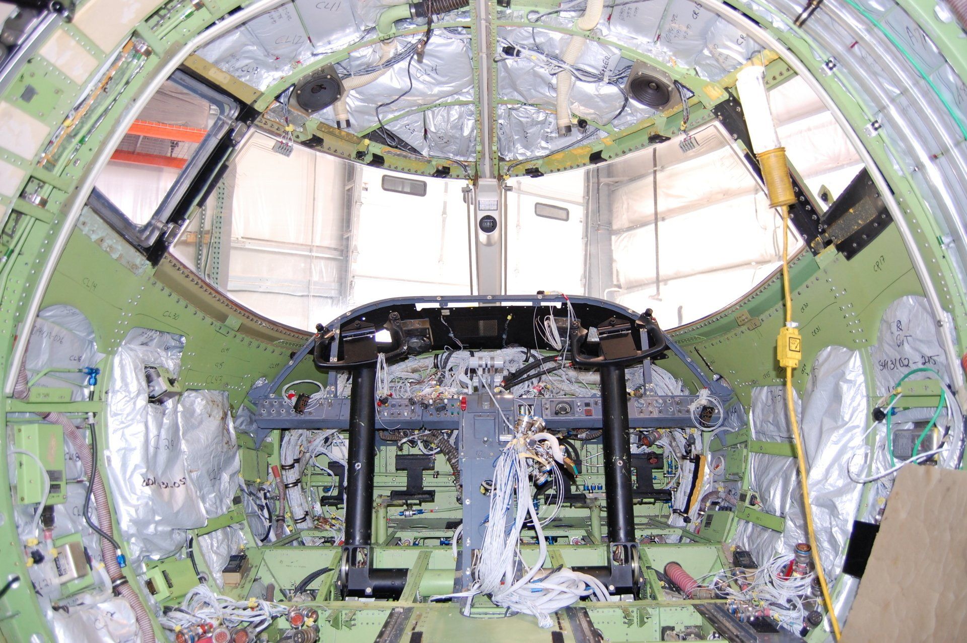 A cockpit of an airplane that is being built