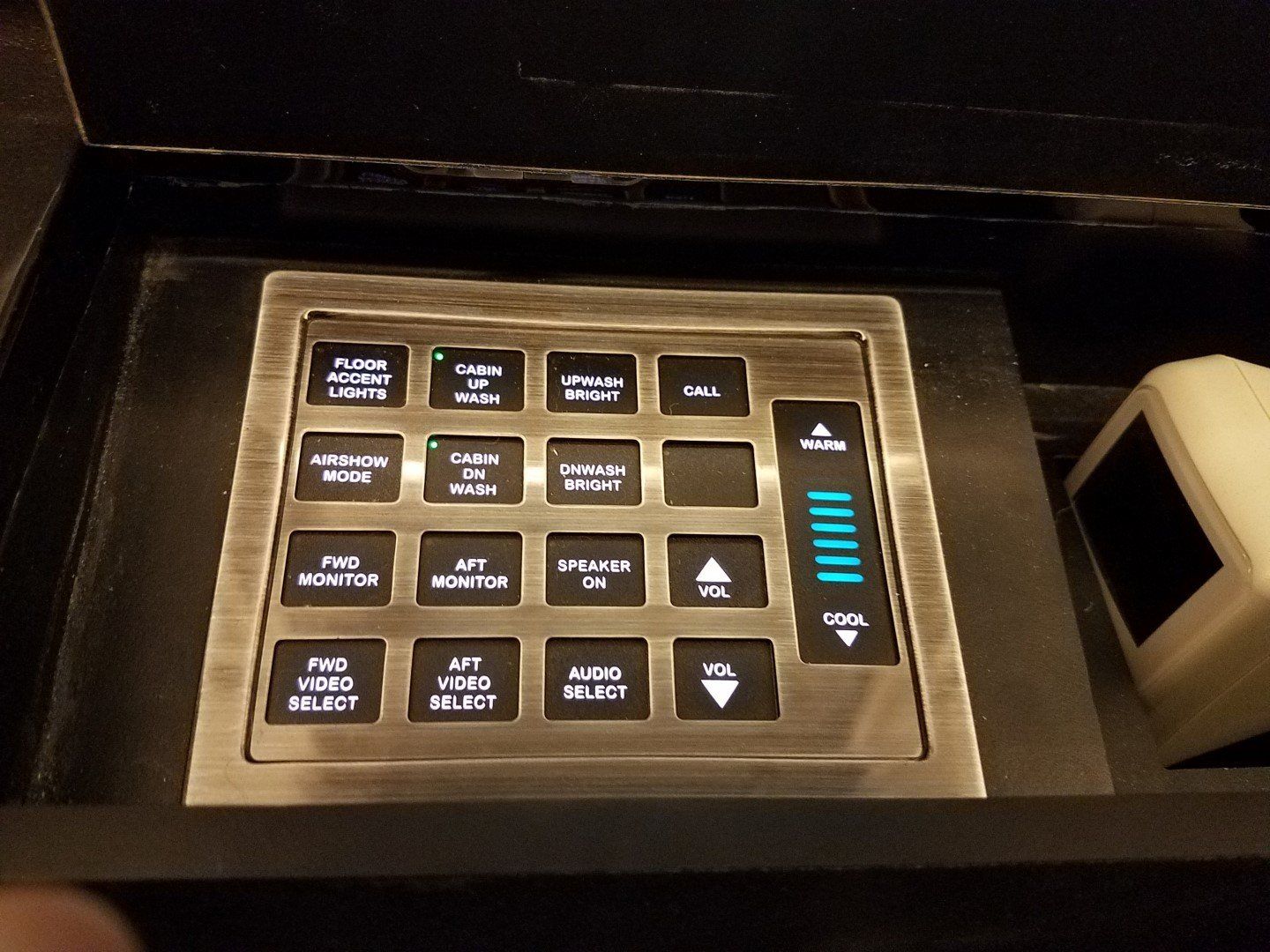 A remote control with a few buttons on it