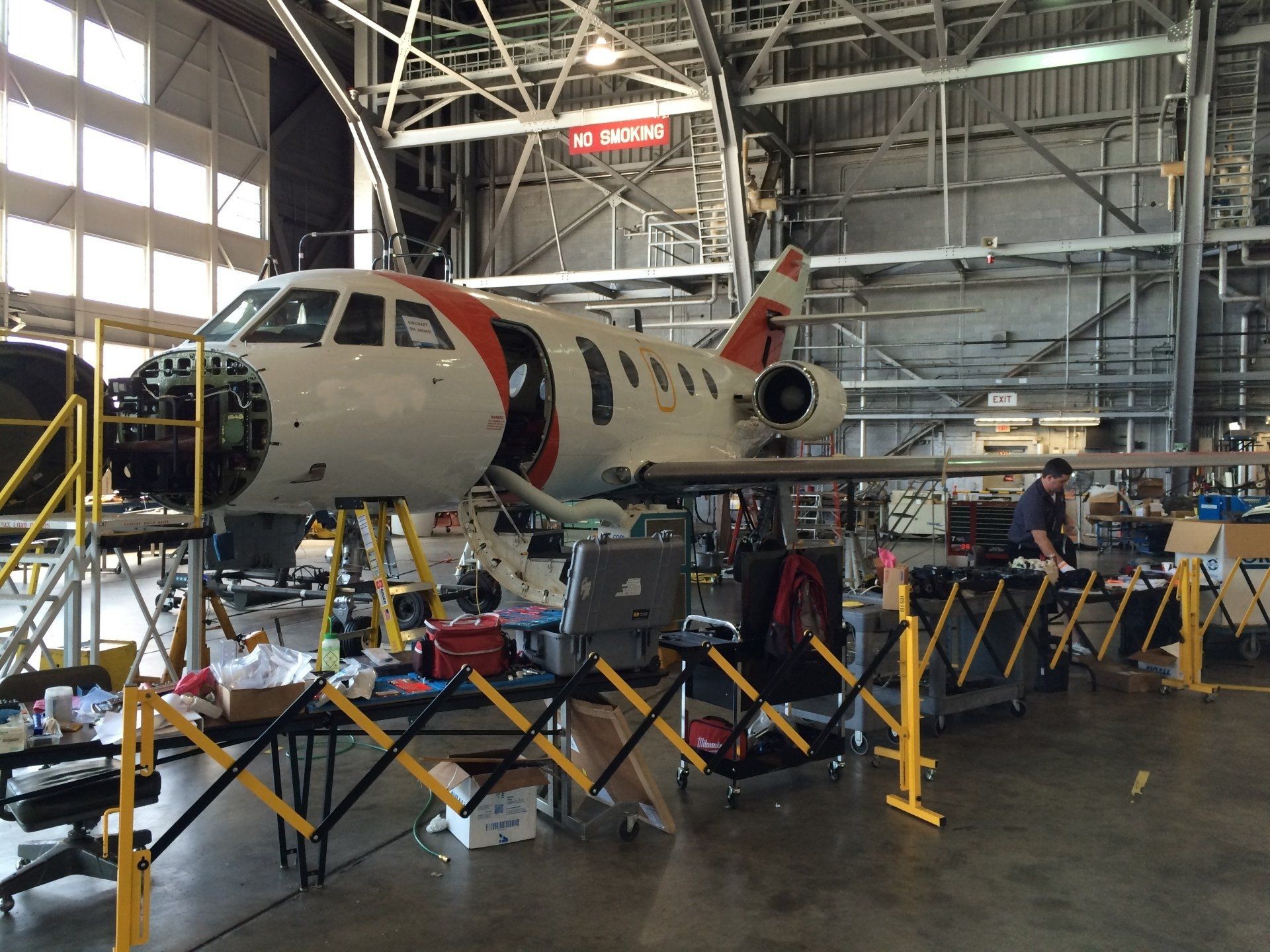 An airplane is being worked on in a hangar