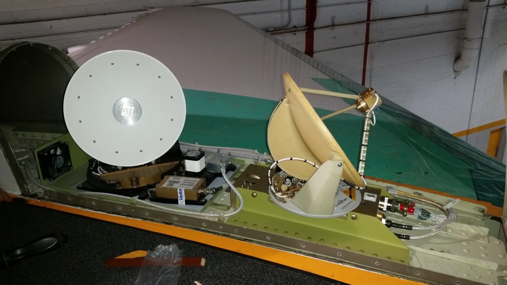 A satellite dish is sitting on top of a table