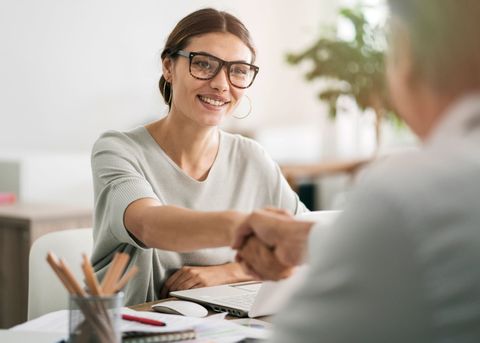 Business Attorney — Female Lawyer Handshakes with Client in Columbus, OH Business Attorney — Female Lawyer Handshakes with Client in Columbus, OH