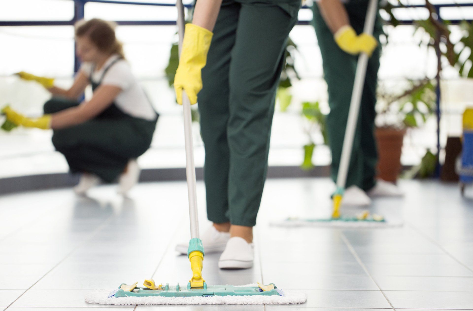 Group of Cleaners Cleaning the Floor – Cheyenne, WY – Little Joe Company Group of people cleaning a floor in Fort Collins, CO