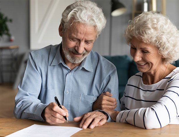 Old Couple Signing Papers — Springfield, MO — Dunn Law Firm LLC Old Couple Signing Papers — Springfield, MO — Dunn Law Firm LLC
