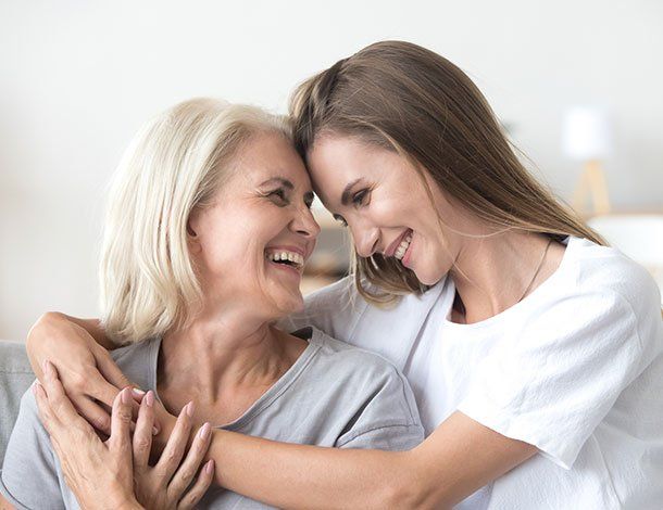 Women Hugging — Springfield, MO — Dunn Law Firm LLC Women Hugging — Springfield, MO — Dunn Law Firm LLC