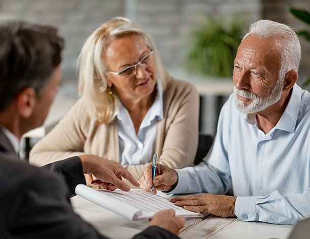Elderly Couple Talking To Their Attorney — Springfield, MO — Dunn Law Firm LLC Elderly Couple Talking To Their Attorney — Springfield, MO — Dunn Law Firm LLC