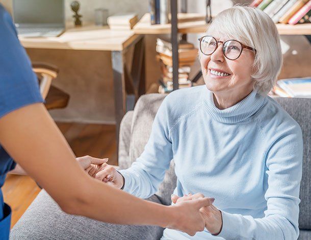Elder Woman Holding Nurse's Hands — Springfield, MO — Dunn Law Firm LLC Elder Woman Holding Nurse's Hands — Springfield, MO — Dunn Law Firm LLC