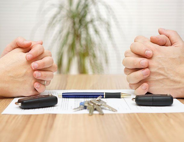 Couple With Their Hands On The Table — Springfield, MO — Dunn Law Firm LLC Couple With Their Hands On The Table — Springfield, MO — Dunn Law Firm LLC