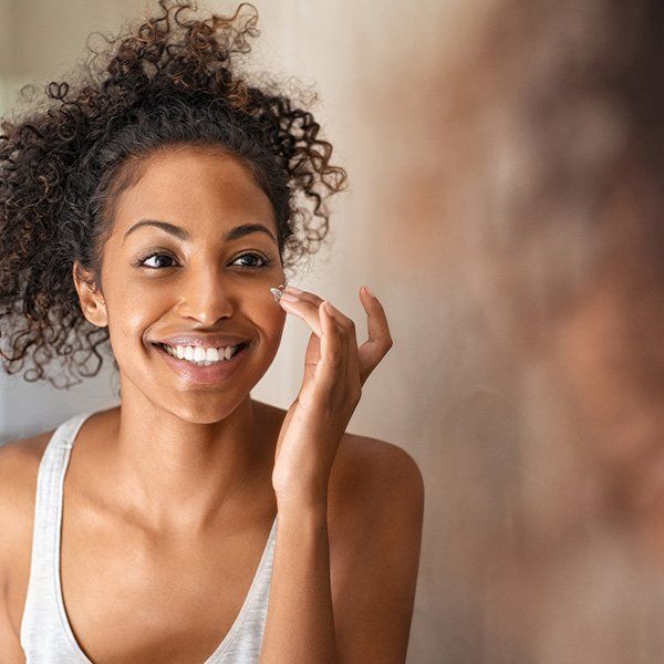 Woman Applying Facial Cream โ Metairie, LA โ Dr. Carter D. Paddock