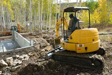 Bricklayer building wall using trowel — Construction Services in Allenstown, NH