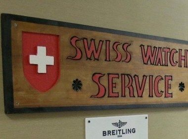 Photo of our company name and swiss logo