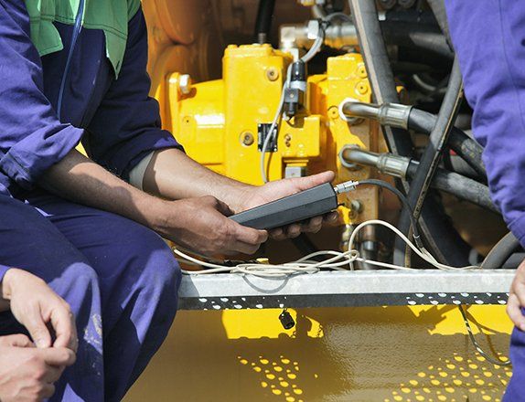 Technician Performing Generator Maintenance — Clairsville, OH — Bryan Electric Inc.