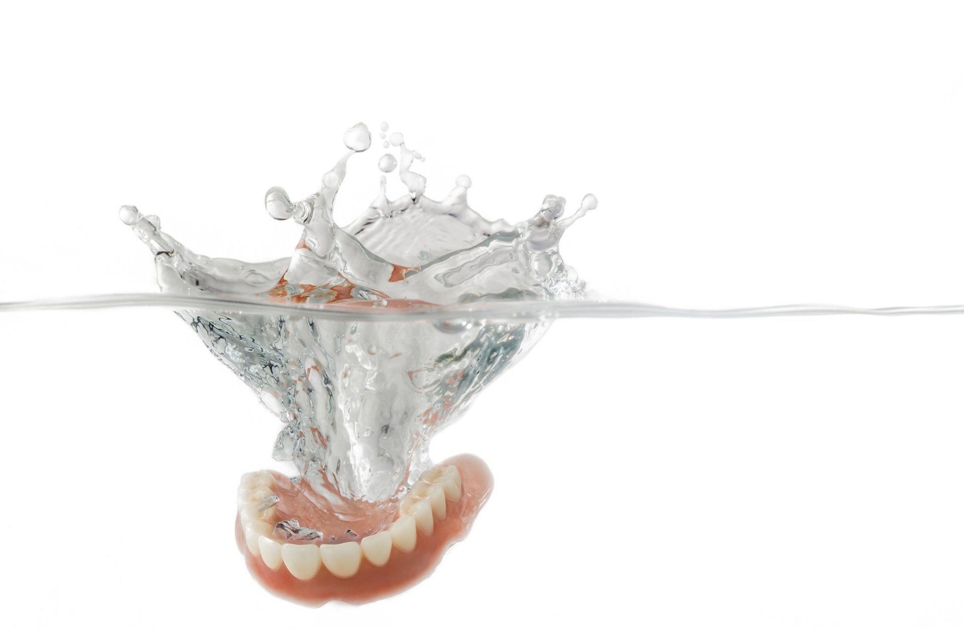 Dentures Splashing into Water — Warren, Ohio — Lordstown Dental Clinic