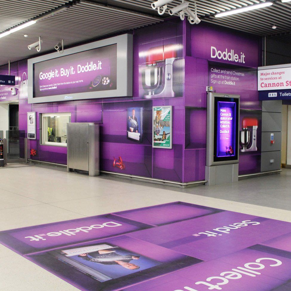 A purple wall with a sign that says doddle.it