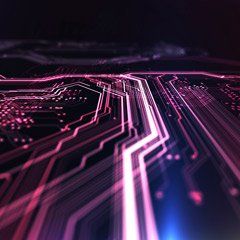 A close up of a computer circuit board with purple and blue lights coming out of it.