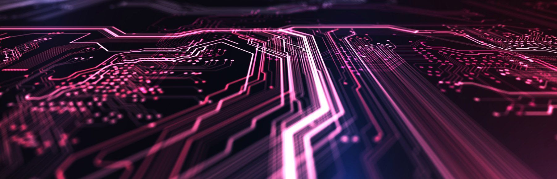A close up of a circuit board with purple lights coming out of it.