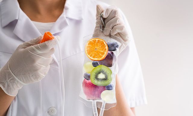 a nurse carrying an IV