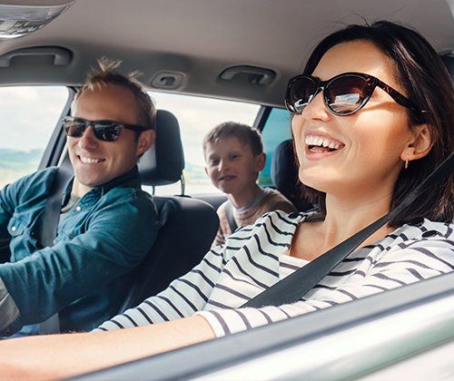 Happy Family Driving Car — Greenwood, SC — Mabry Sanders Insurance Agency Happy Family Driving Car — Greenwood, SC — Mabry Sanders Insurance Agency