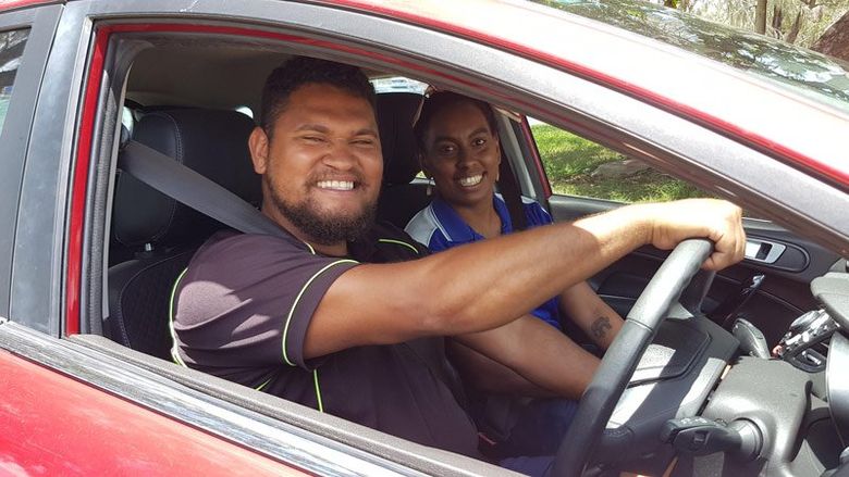 people smiling in car