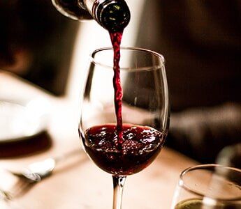 Wine Pouring Into Glass — Liquor Store in Wilmington, DE